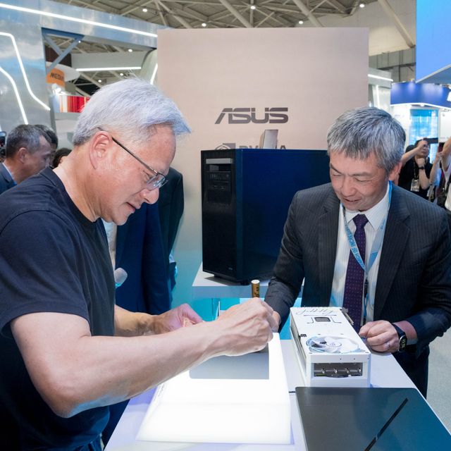 NVIDIA CEO Jensen Huang signs the ASUS Ascent GX10, ROG Astral GeForce RTX 5090 White Edition, and ASUS ExpertCenter Pro ET900N G3.